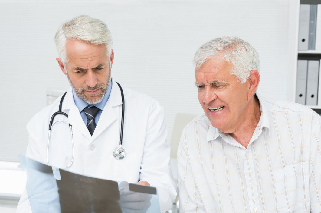 Patient with consultants looking at results